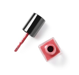 Photo of Bottle of color nail polish with brush on white background, top view