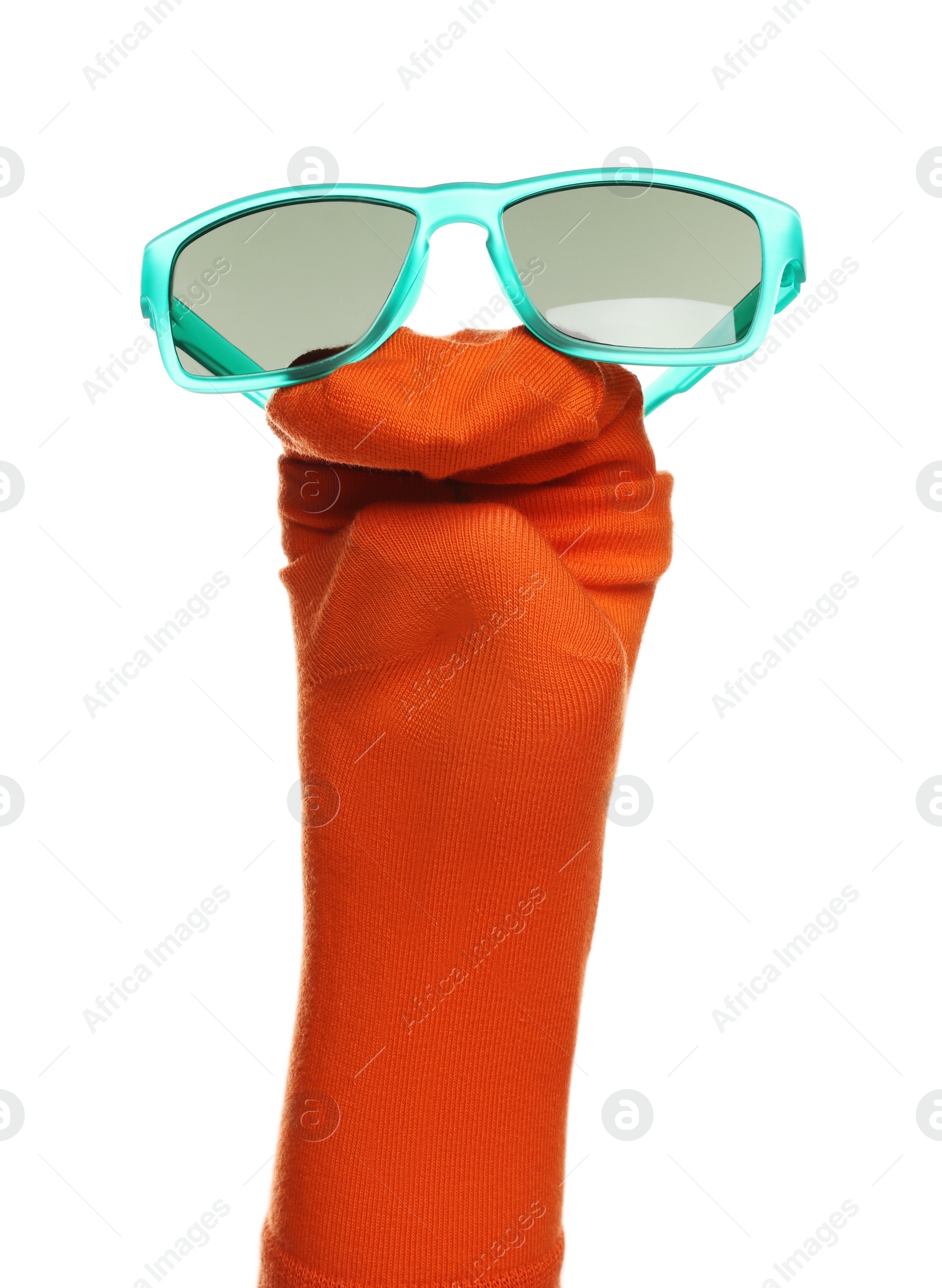 Photo of Funny sock puppet with sunglasses isolated on white