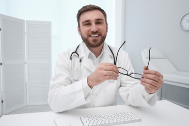 Photo of Pediatrician consulting patient using video chat in clinic, view from webcam