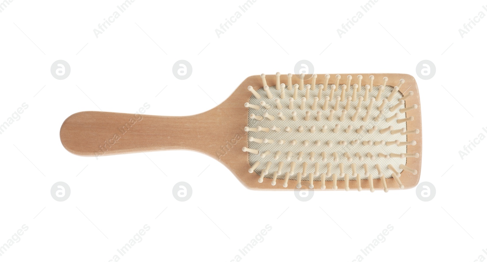 Photo of New wooden hair brush isolated on white, top view