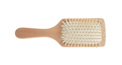 New wooden hair brush isolated on white, top view