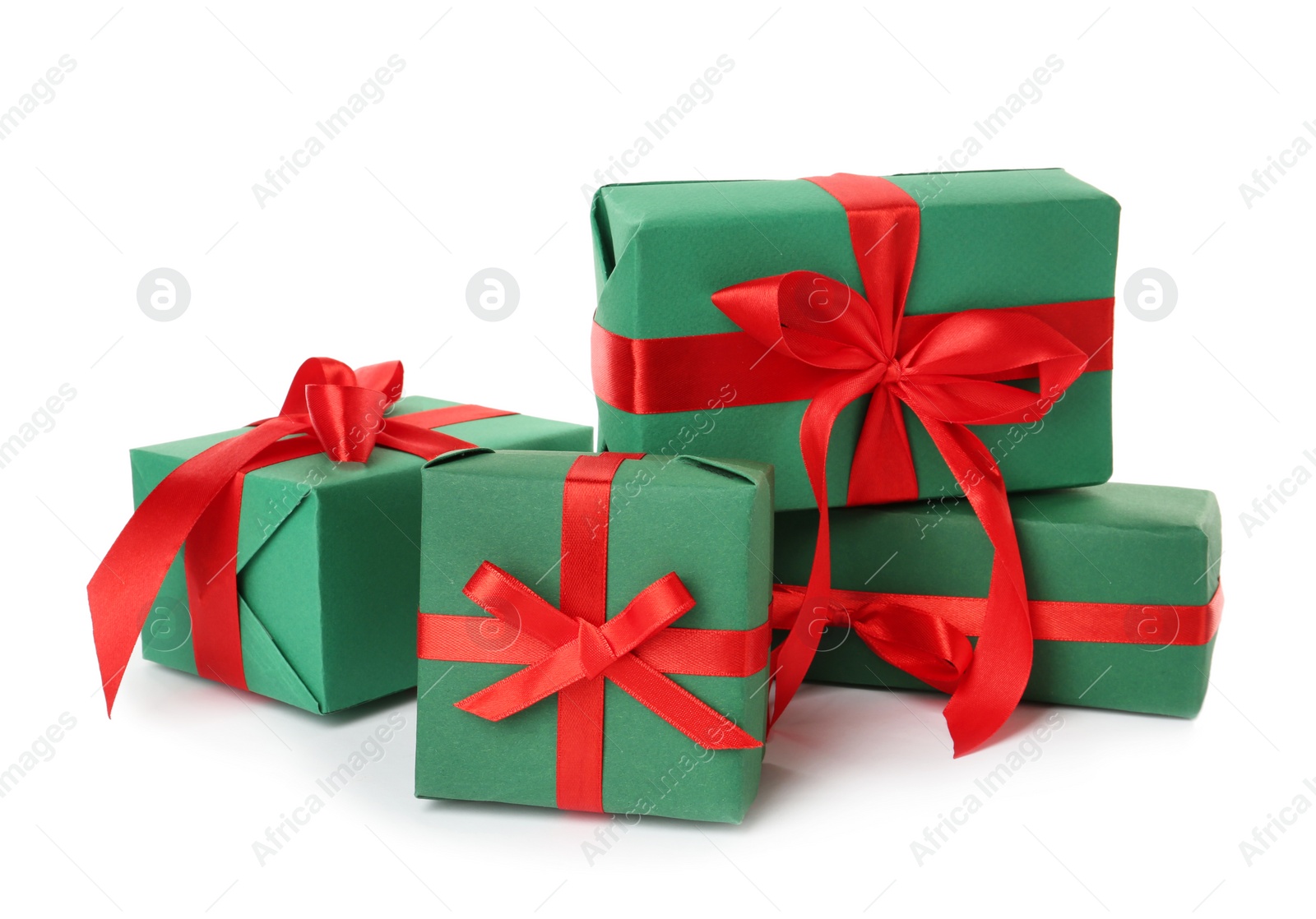 Photo of Green gift boxes with red bows on white background