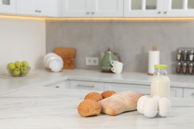 Allergenic food. Different fresh products on light marble table in kitchen, space for text