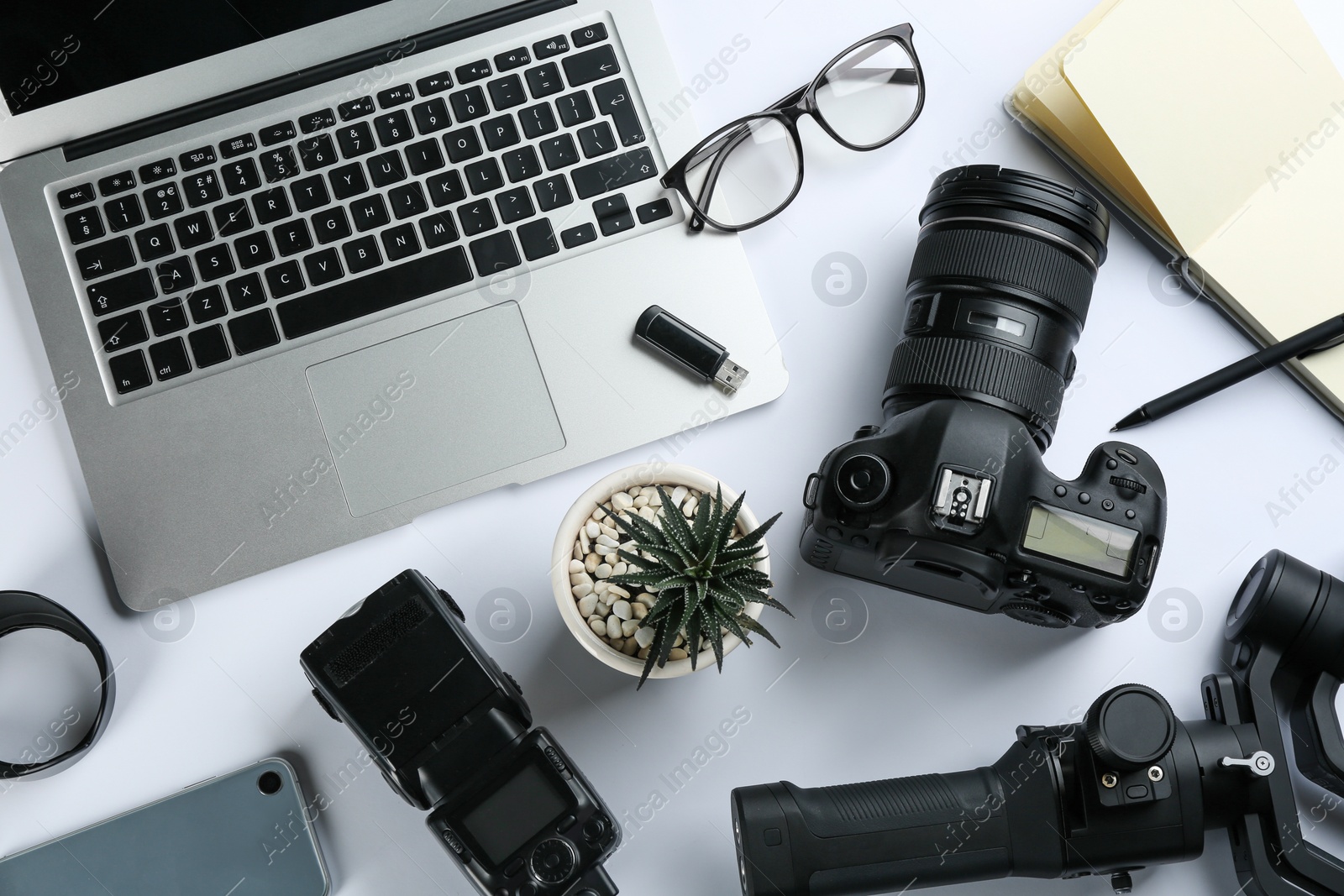 Photo of Composition with camera and video production equipment on white background, top view