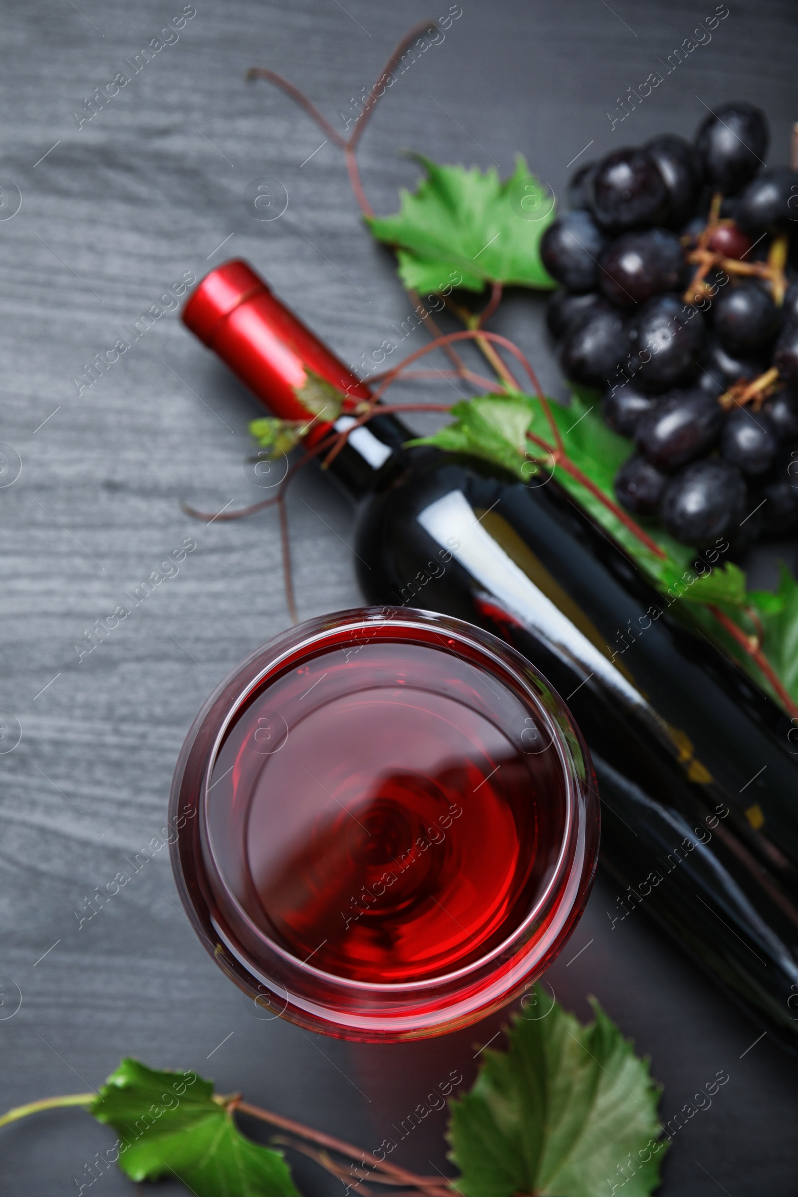 Photo of Flat lay composition with fresh ripe juicy grapes on wooden background