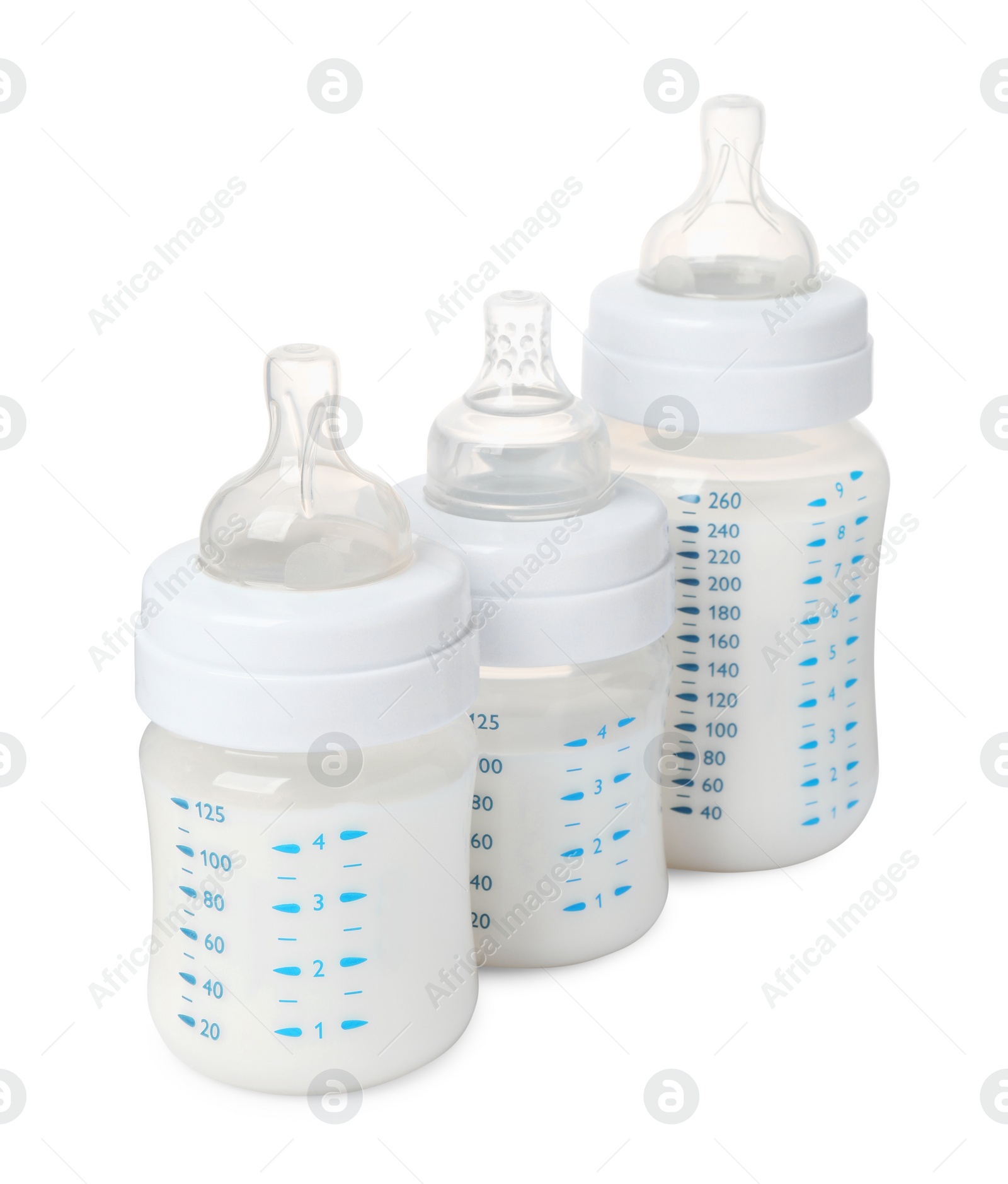 Photo of Three feeding bottles with milk on white background