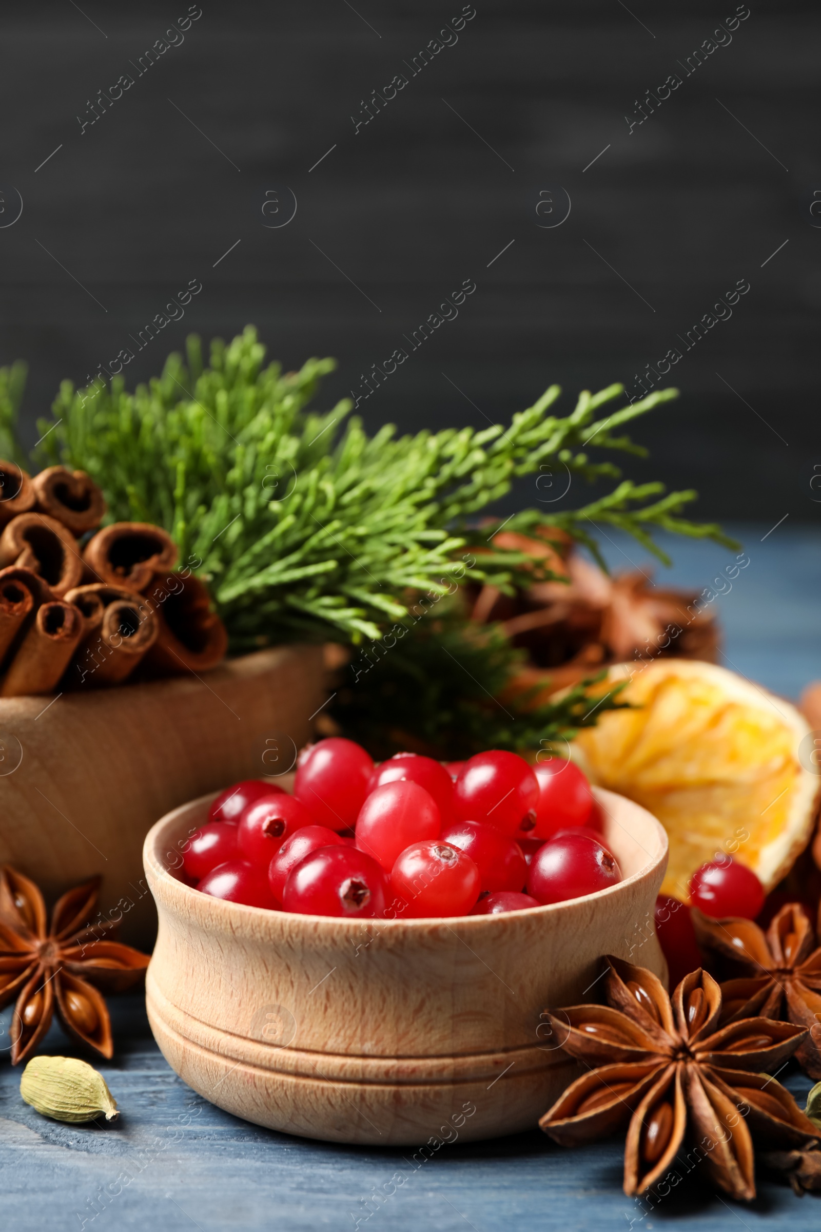 Photo of Composition with mulled wine ingredients on blue wooden table, closeup