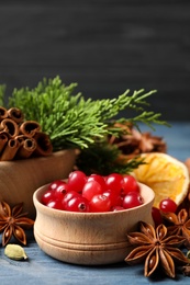 Photo of Composition with mulled wine ingredients on blue wooden table, closeup