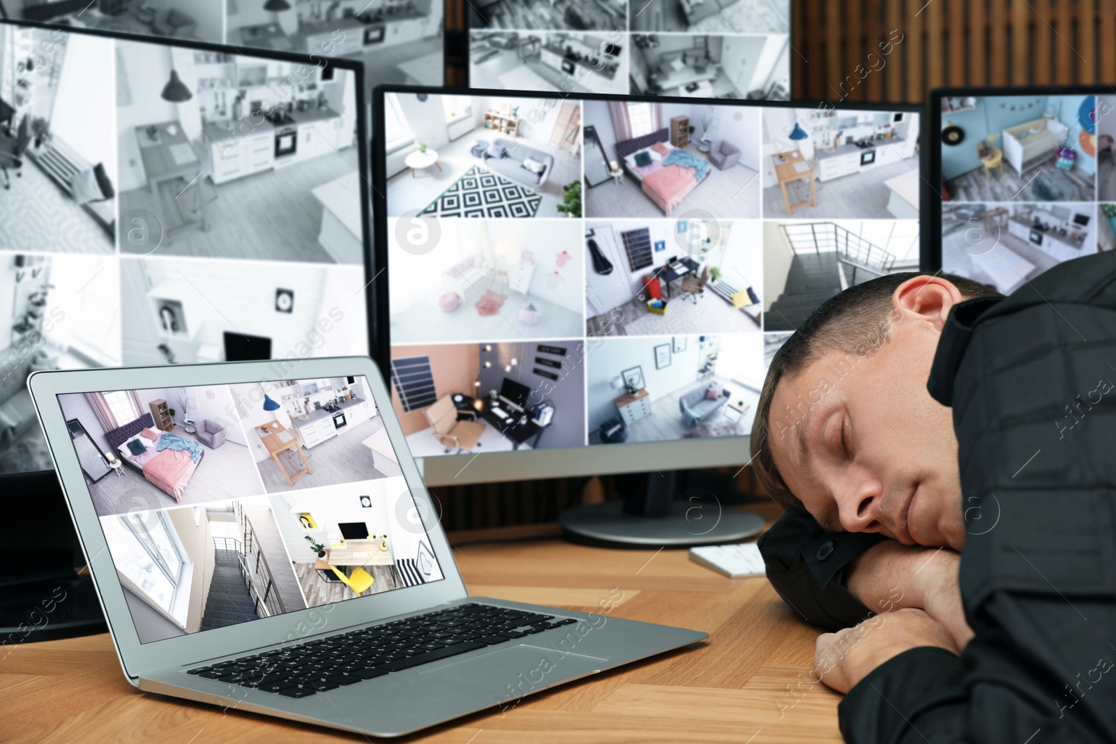 Photo of Tired security guard sleeping at workplace in office