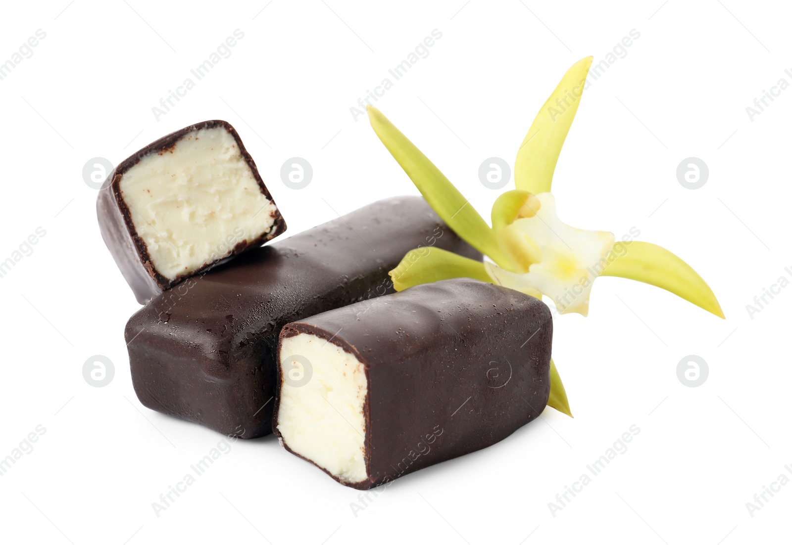 Photo of Glazed curd cheese bars and vanilla flower isolated on white