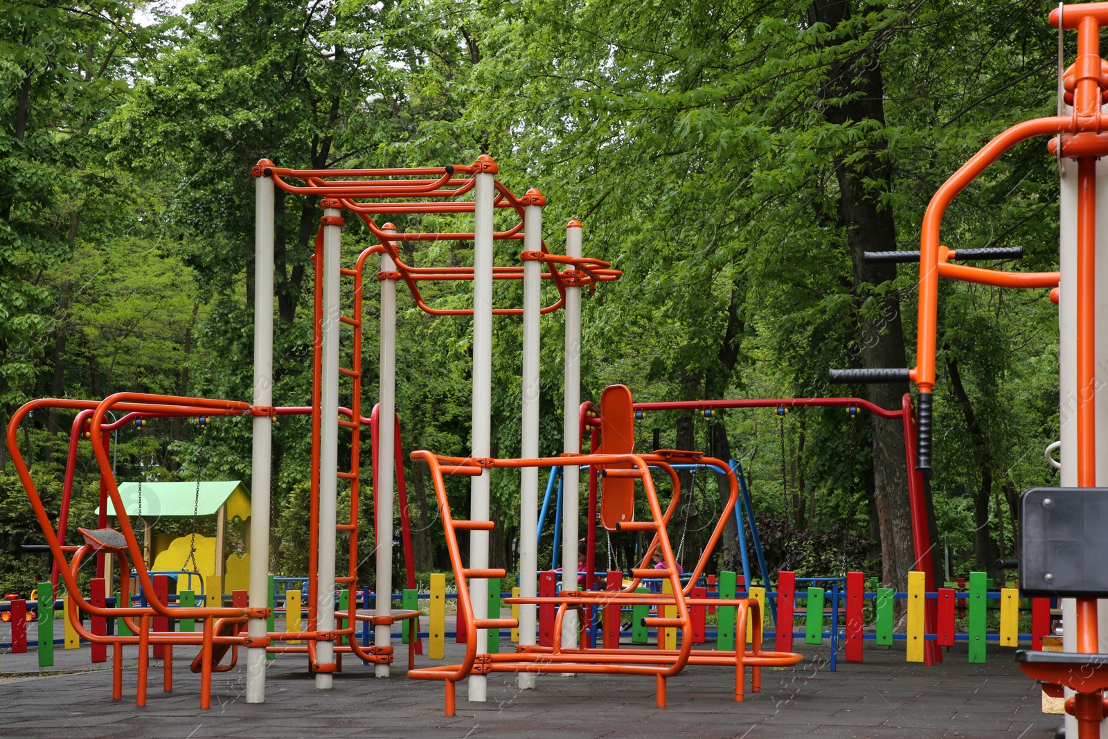 Photo of Outdoor gym and children's playground with monkey bars in park