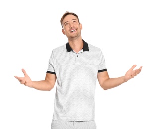 Photo of Young man in casual clothes posing on white background