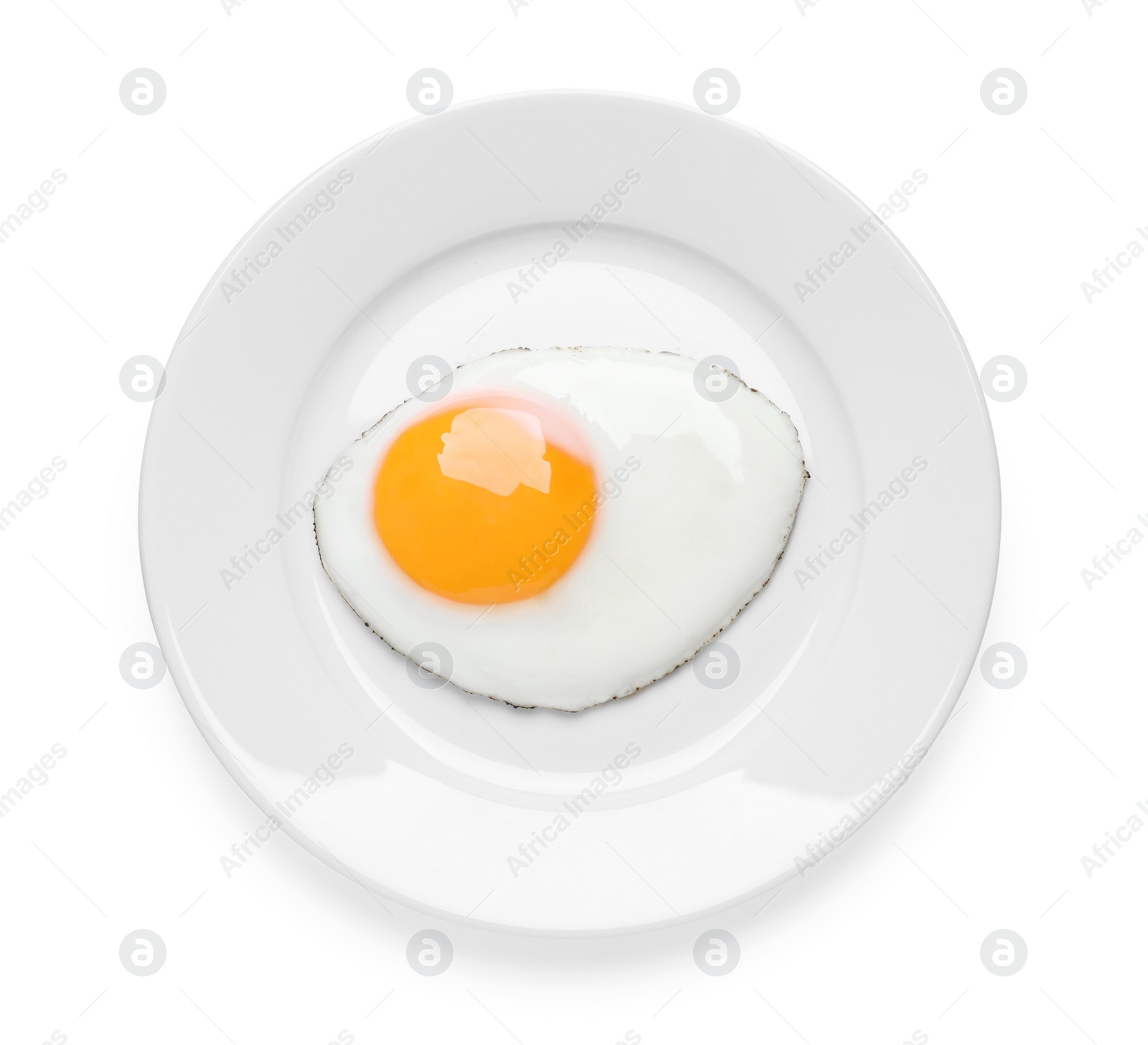 Photo of Plate with delicious fried egg isolated on white, top view