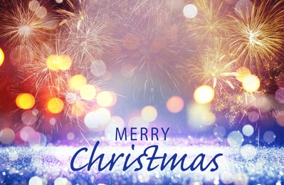 Image of Text Merry Christmas on festive background with fireworks. Bokeh effect