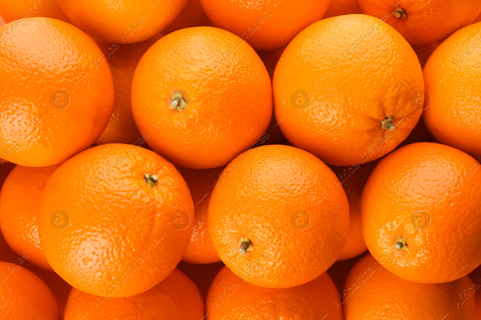 Photo of Fresh ripe oranges as background, top view