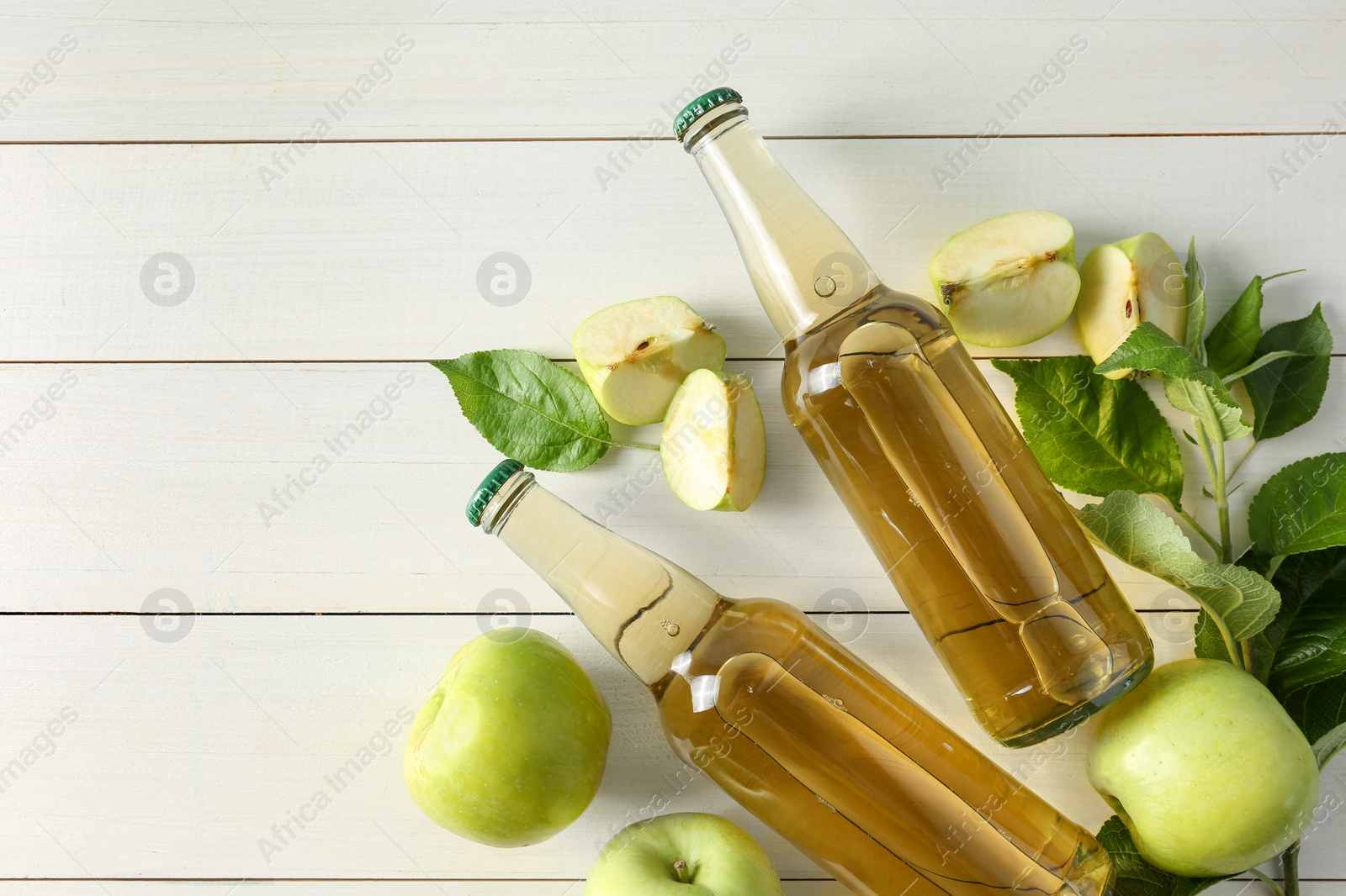 Photo of Flat lay composition with delicious apple cider on white wooden table, space for text