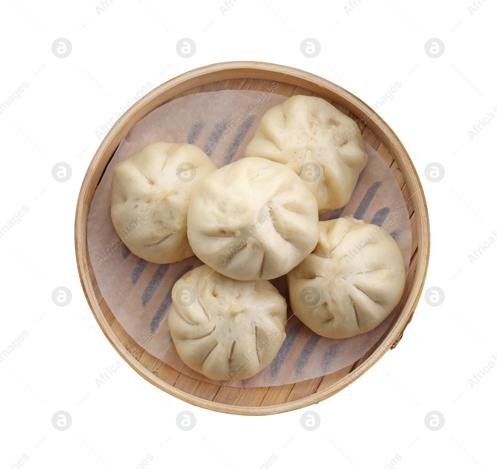 Photo of Delicious bao buns (baozi) in bamboo steamer isolated on white, top view