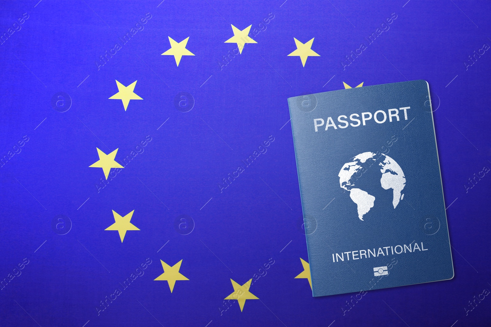 Image of International passport on flag of European Union, top view