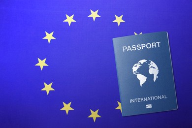 Image of International passport on flag of European Union, top view