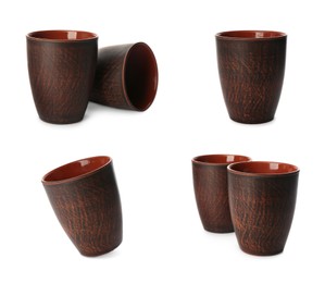 Image of Set with clay cups on white background