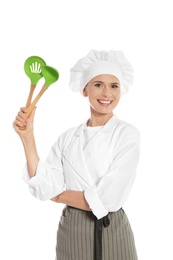 Photo of Female chef with ladle and slotted spoon on white background