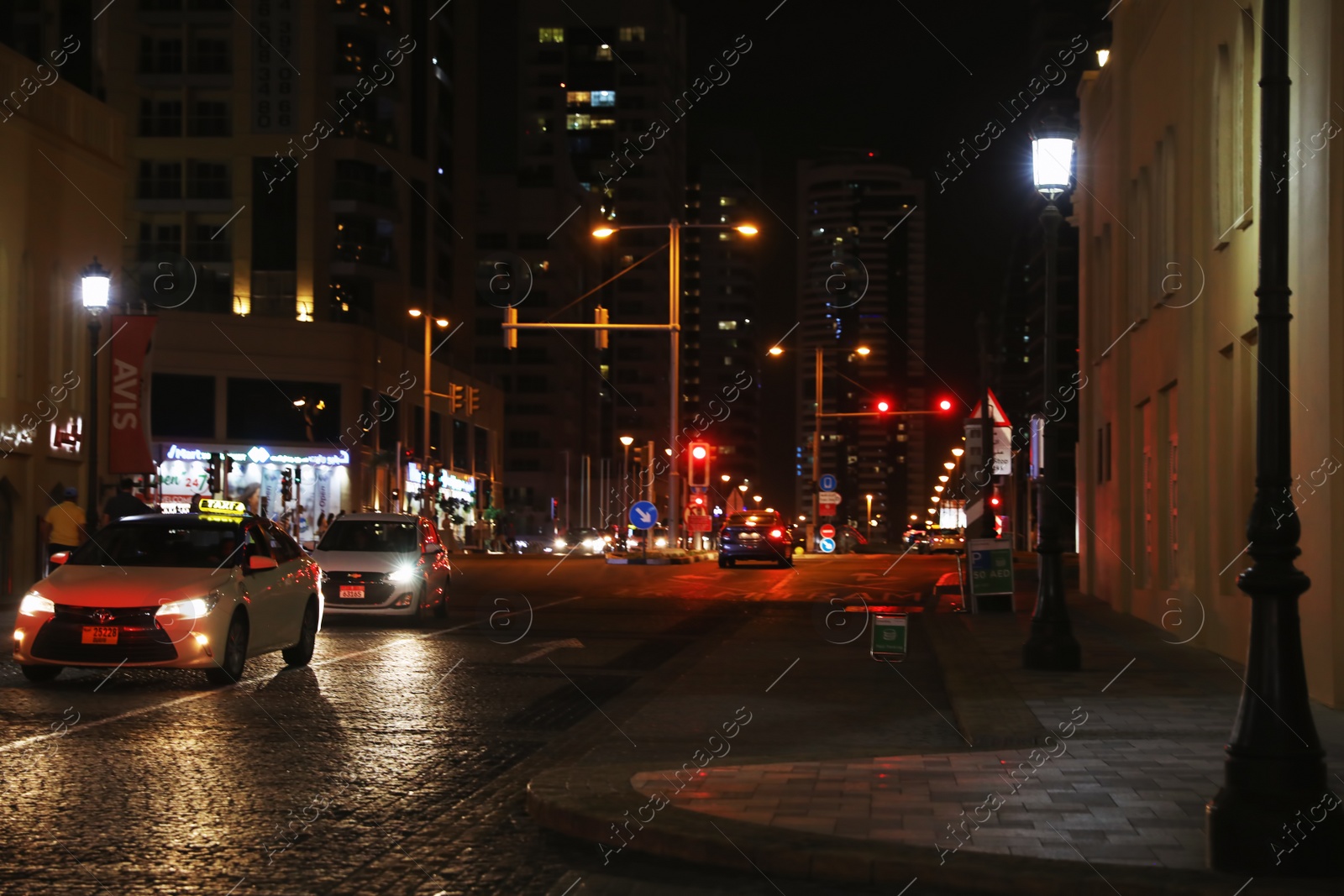 Photo of DUBAI, UNITED ARAB EMIRATES - NOVEMBER 03, 2018: City street traffic at night