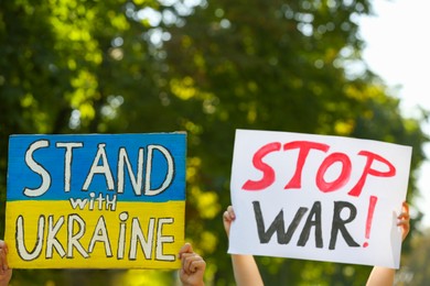 Photo of Rally dedicated to support Ukraine. People holding posters outdoors