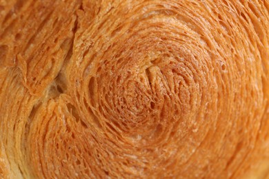 Photo of Tasty puff pastry. Supreme croissant as background, closeup