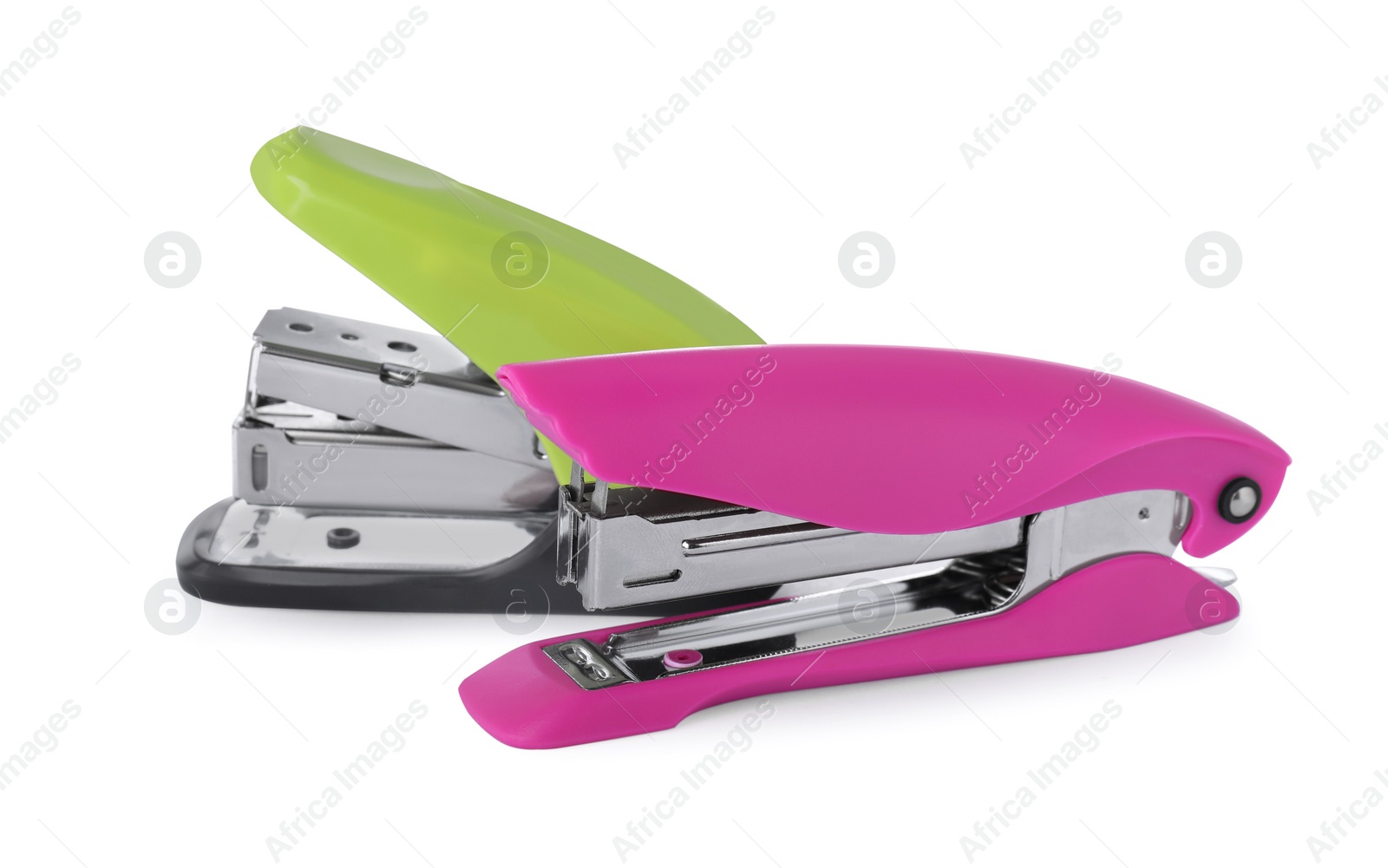 Photo of New bright color staplers isolated on white