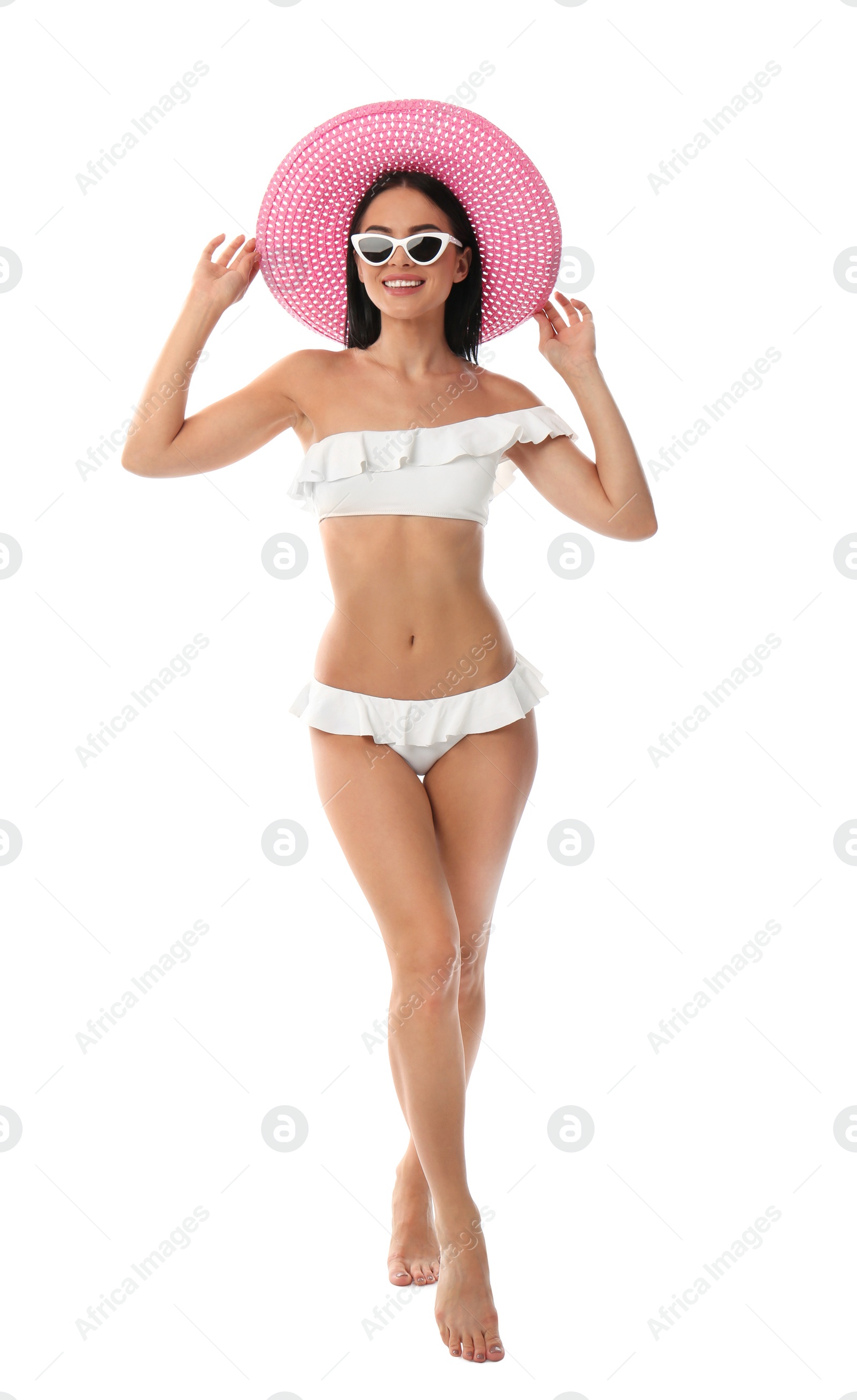 Photo of Beautiful young woman in stylish bikini with hat on white background