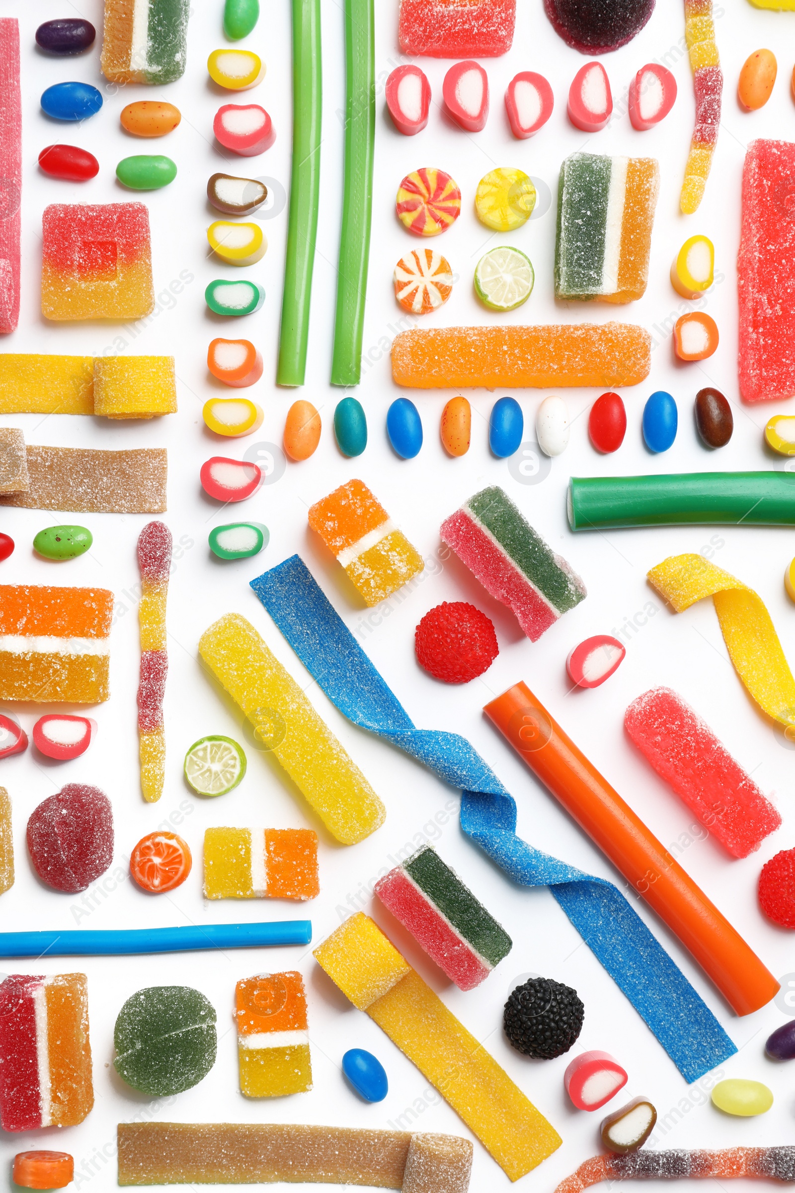 Photo of Flat lay composition with delicious colorful candies on white background