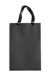 One black paper shopping bag isolated on white, top view