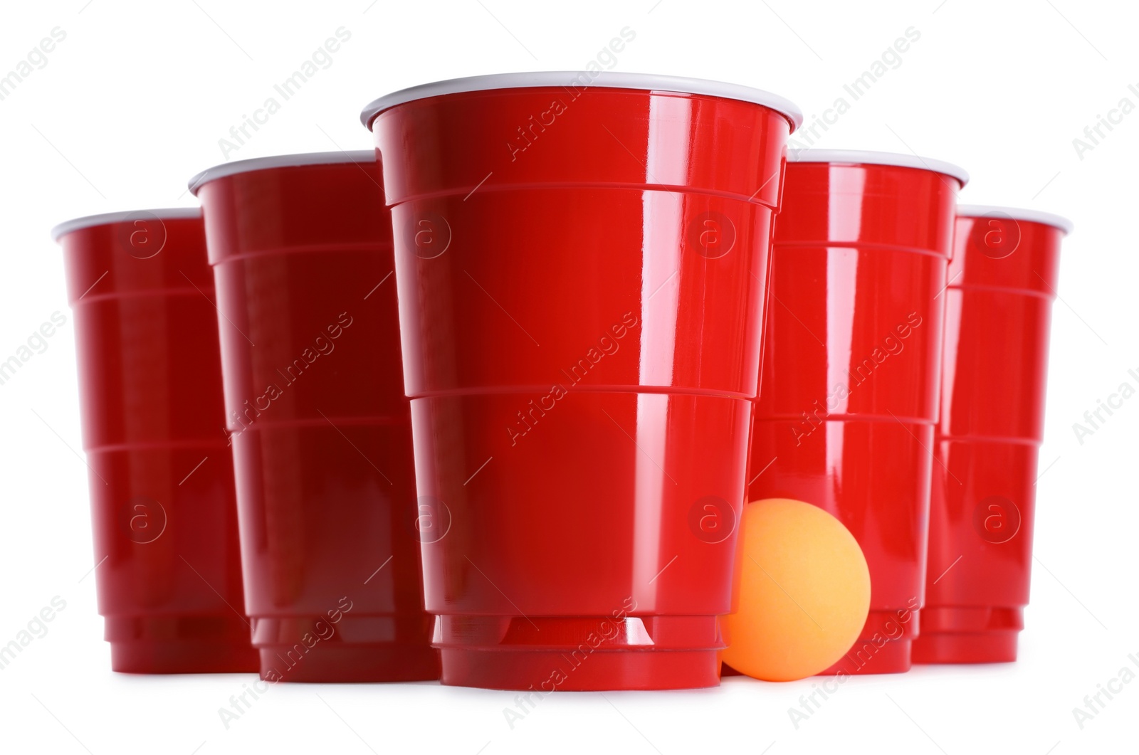 Photo of Plastic cups and ball for beer pong on white background