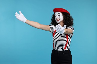 Photo of Funny mine with beret posing on light blue background