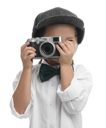 Photo of Cute little detective taking photo with vintage camera on white background