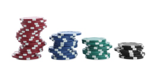 Photo of Stacks of casino poker chips on white background
