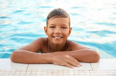 Photo of Happy cute boy in swimming pool