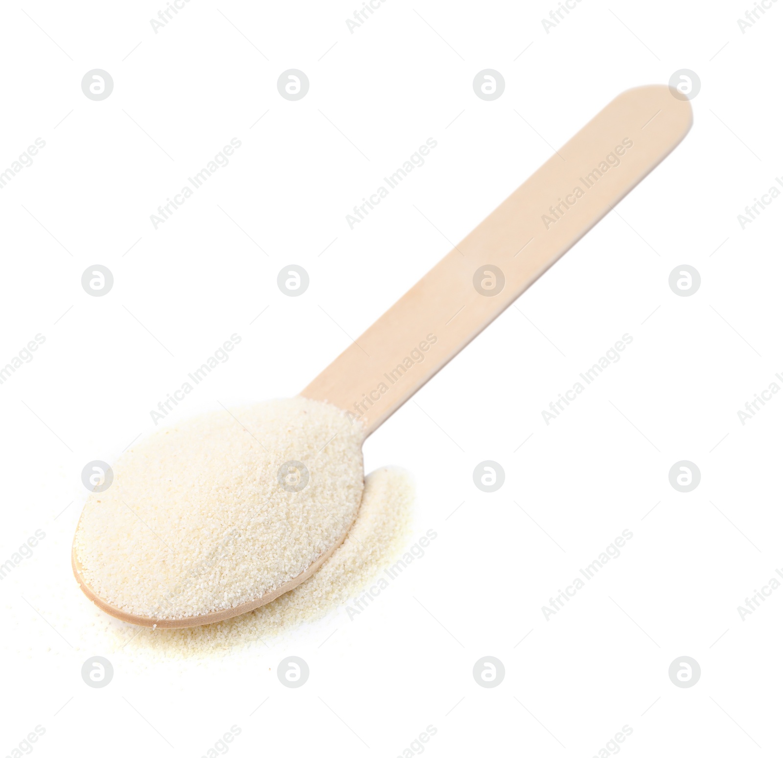 Photo of Spoon with uncooked organic semolina isolated on white