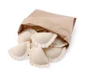 Paper bag of raw dumplings (varenyky) with tasty filling on white background