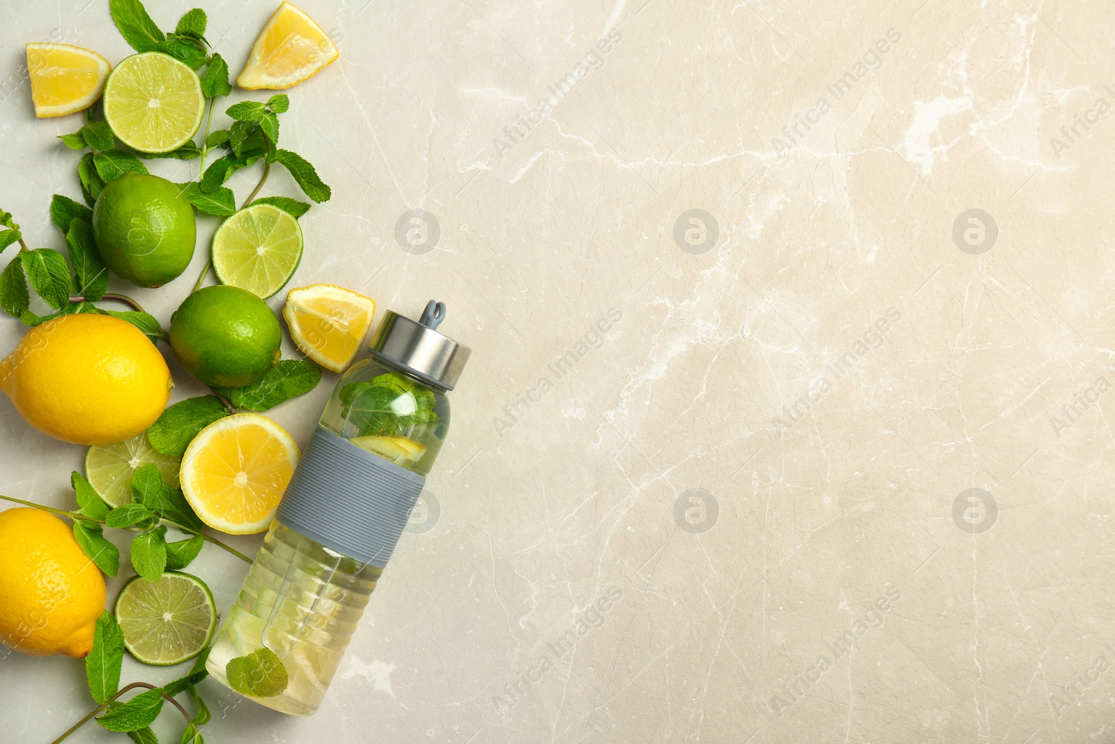 Photo of Flat lay composition with delicious natural lemonade on light background