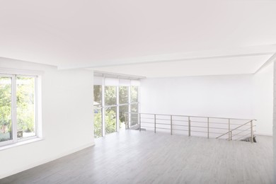 Photo of Empty room with windows and laminated floor