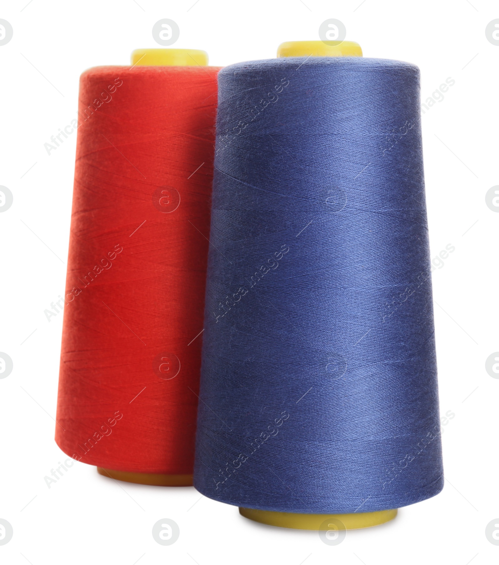 Photo of Different colorful sewing threads on white background