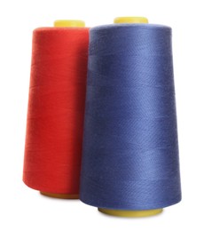 Photo of Different colorful sewing threads on white background