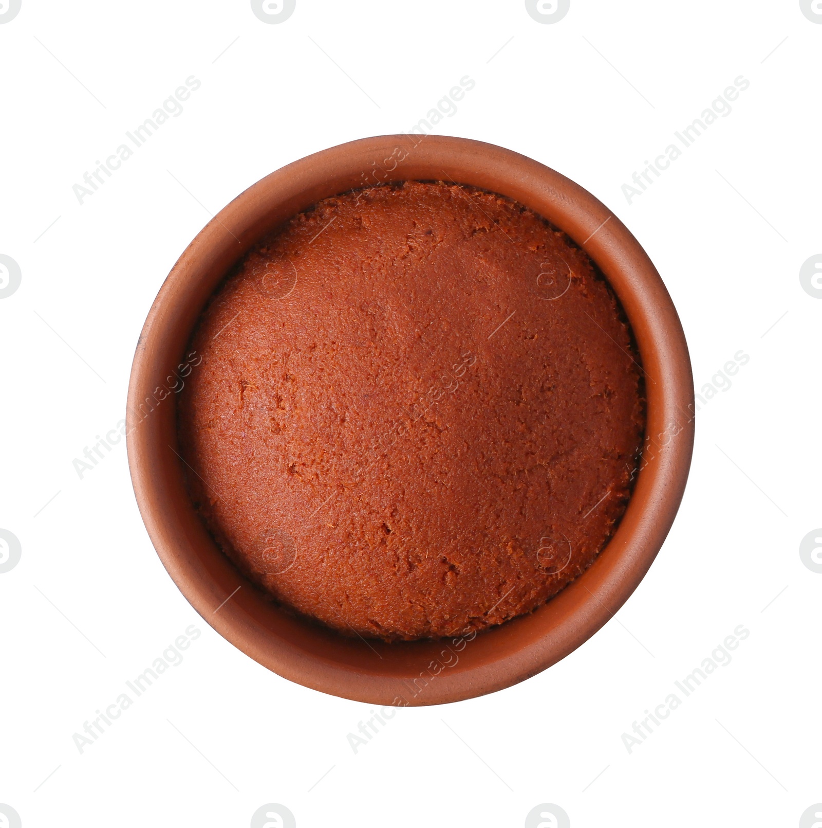 Photo of Tasty curry paste in bowl isolated on white, top view