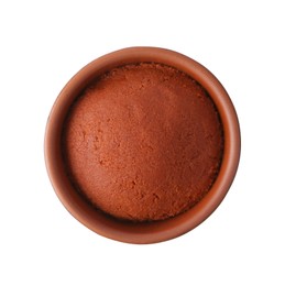 Photo of Tasty curry paste in bowl isolated on white, top view