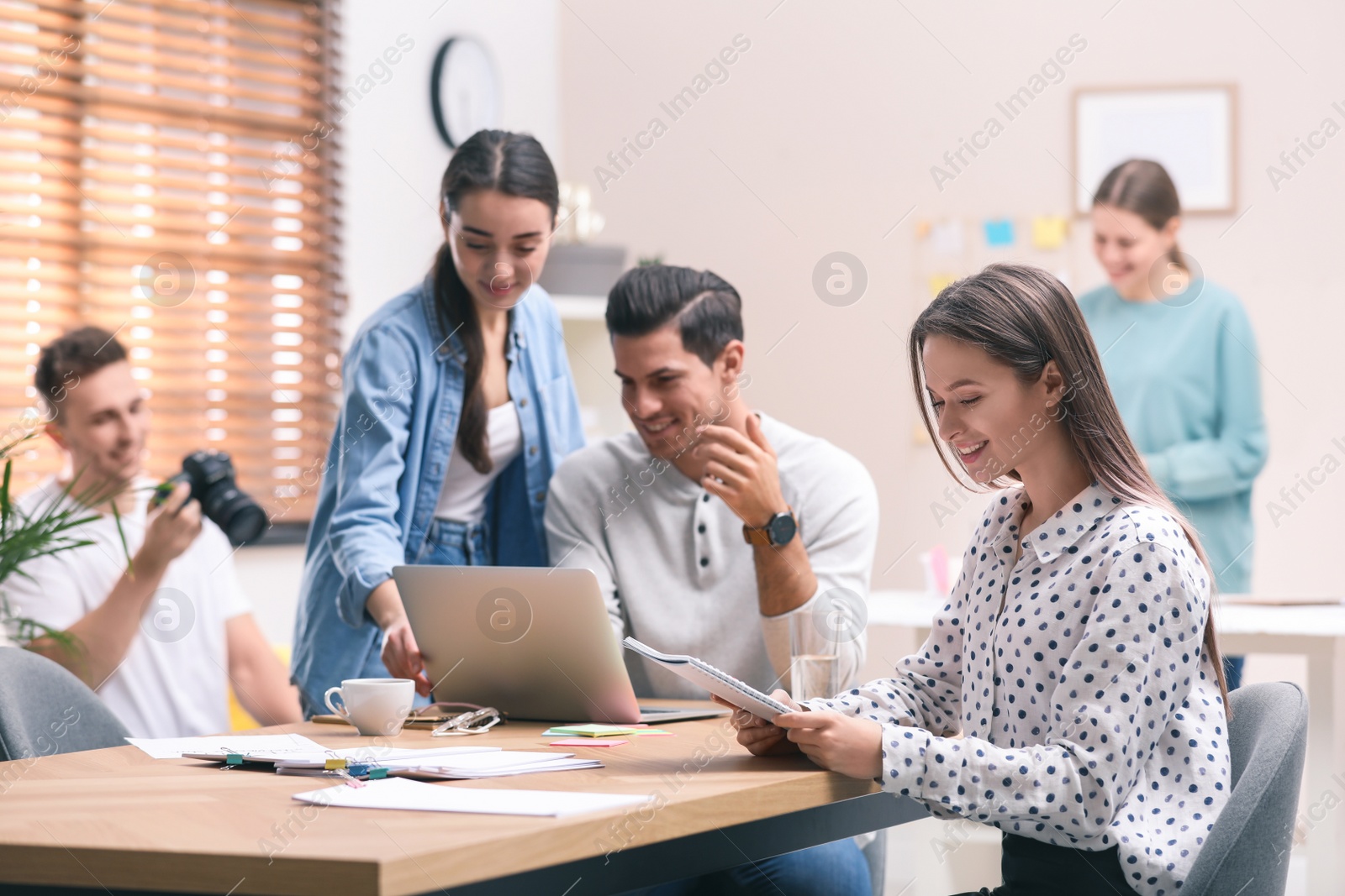 Image of Team of professional journalists working in office