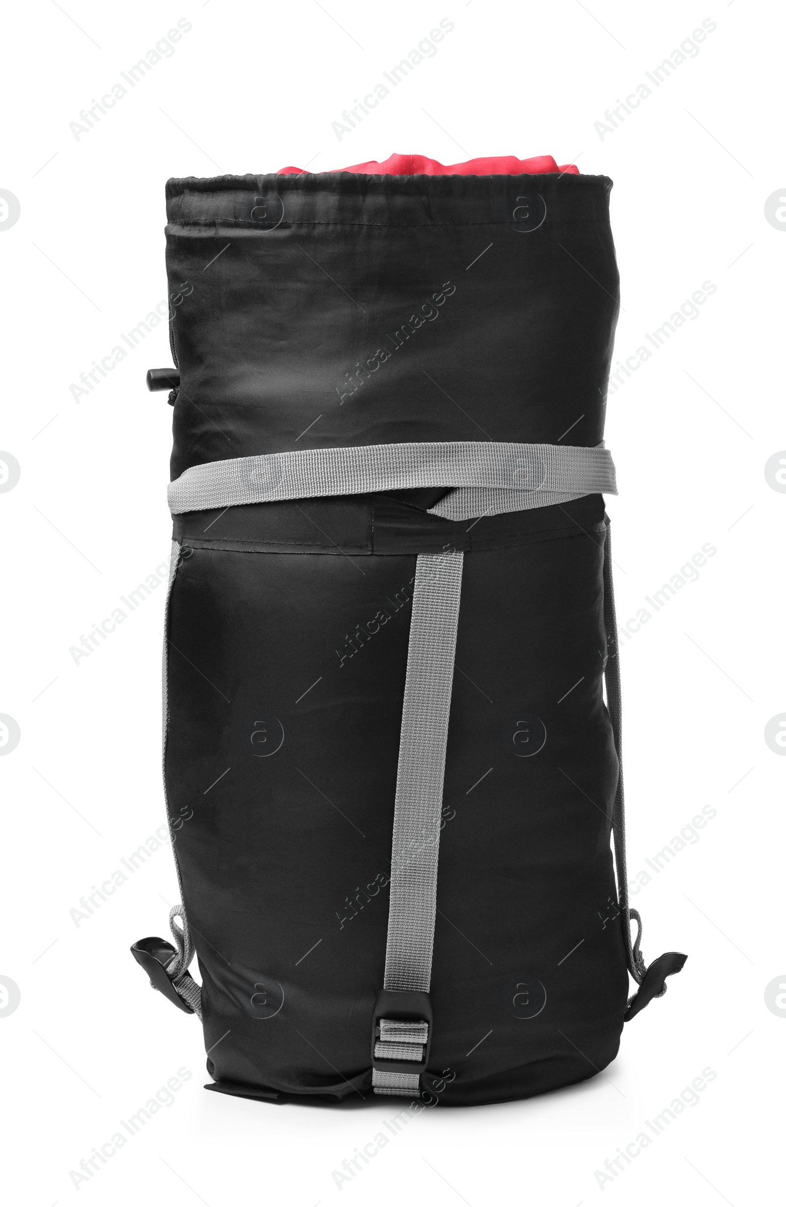 Photo of Sleeping bag in case isolated on white. Tourist equipment