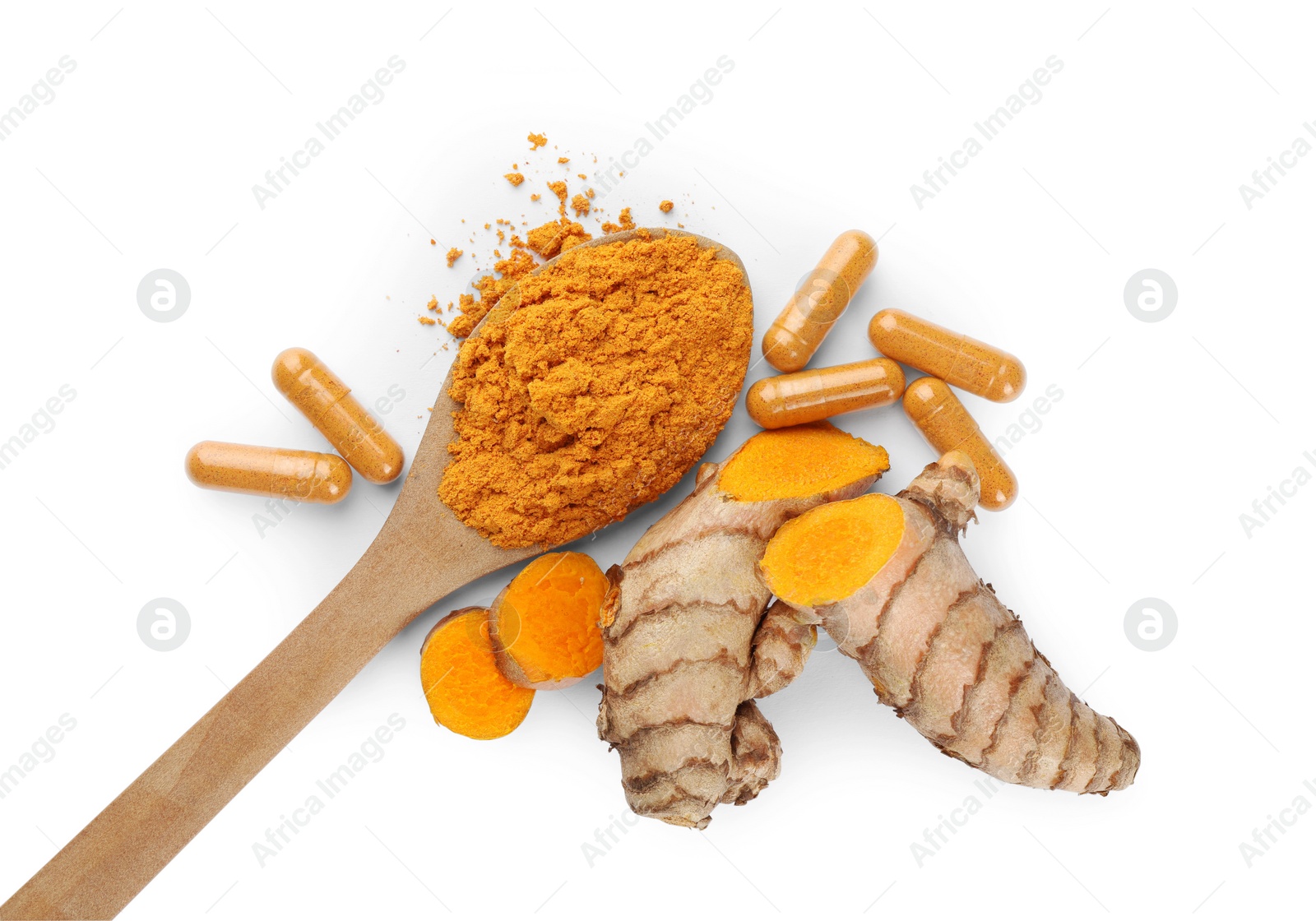 Photo of Spoon with aromatic turmeric powder, pills and raw roots isolated on white, top view