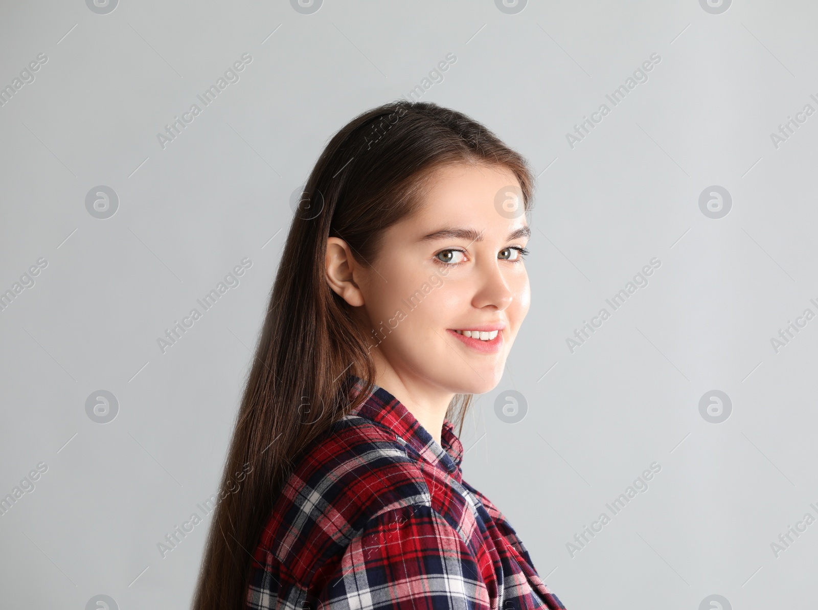 Photo of Portrait of young woman on light background