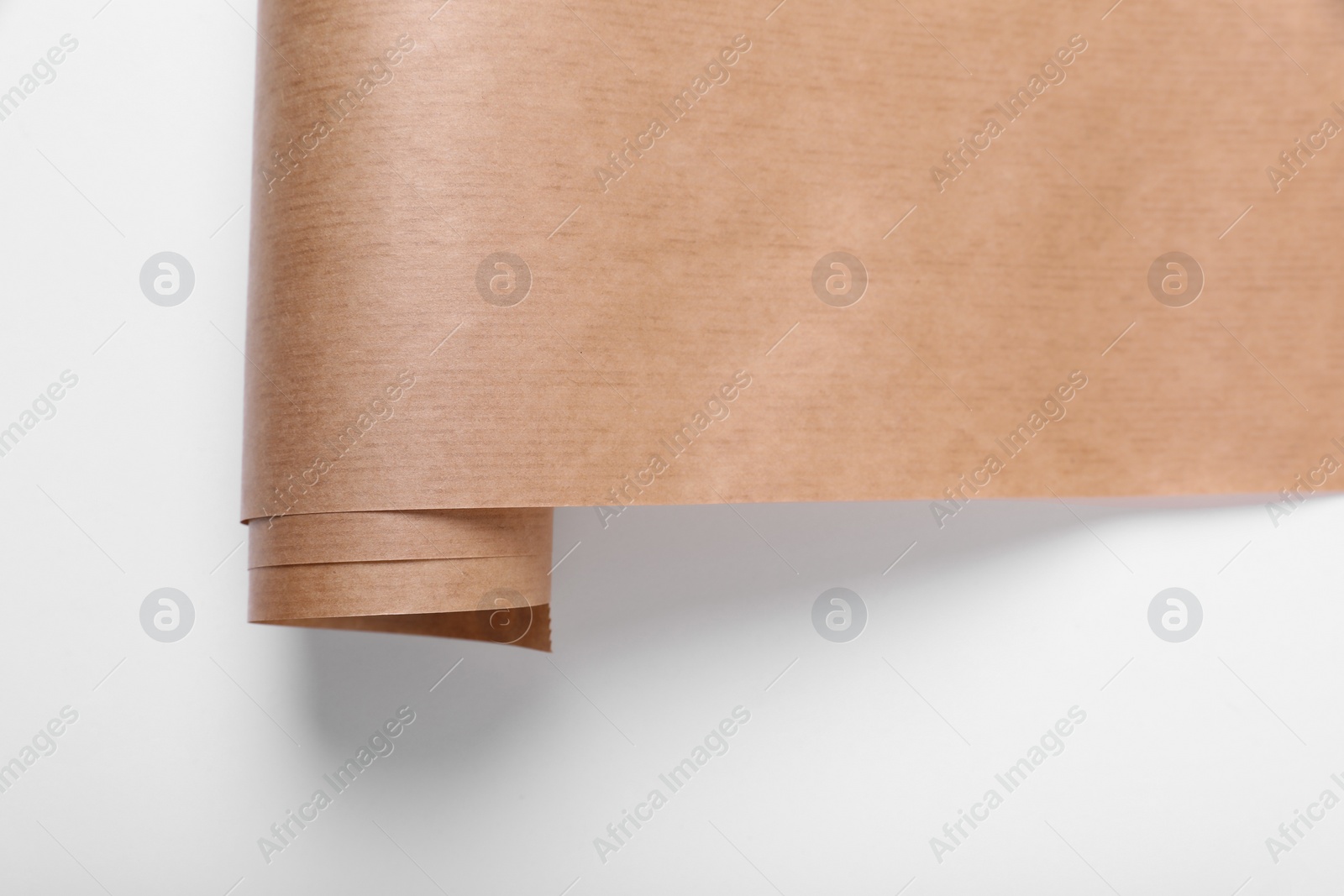 Photo of Roll of wrapping paper on white background, top view